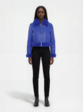 Female model wearing Maverick Cobalt shearling biker jacket, cropped fit, styled with black skinny jeans and leather ankle boots. Maverick Jacket.