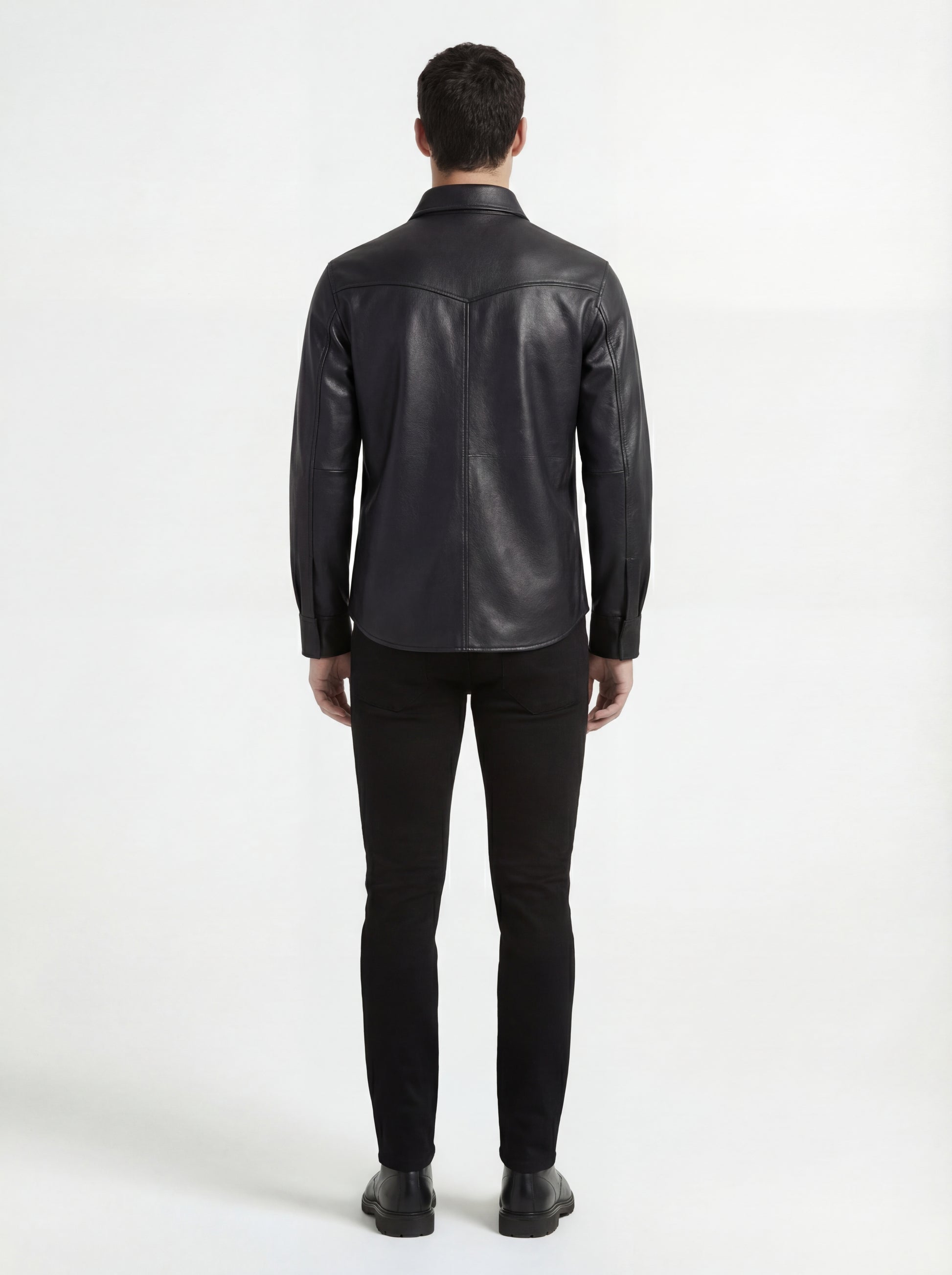 Rear view of male model wearing Maverick Easton leather western shirt showing tailored shoulder fit and western yoke styling. Maverick Jacket.