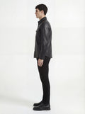 Side profile of Maverick Easton leather western shirt showing long sleeve cuff structure and straight silhouette. Maverick Jacket.
