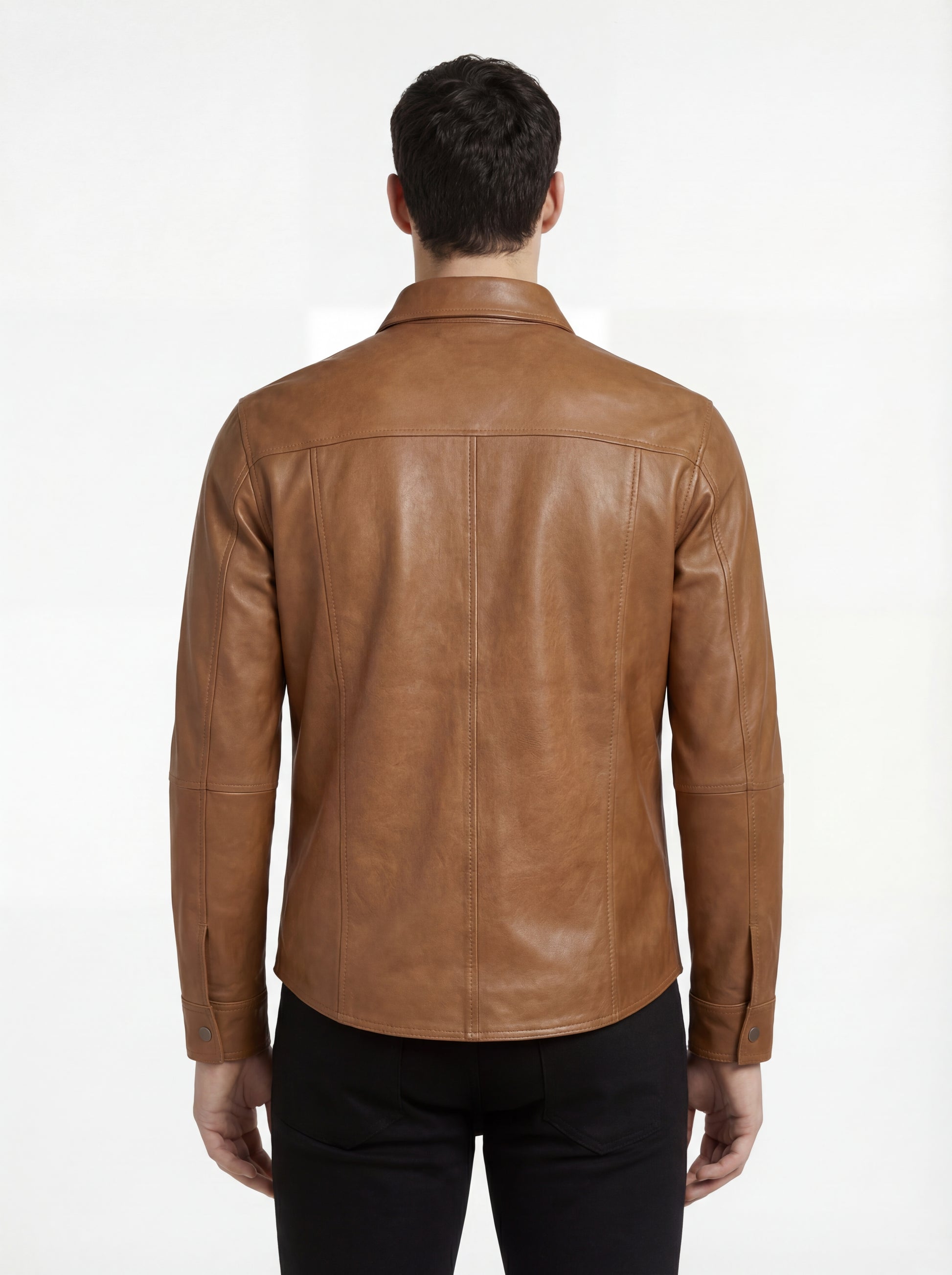 Rear view of male model wearing Maverick Colton tan leather western shirt showing tailored shoulder fit and western yoke styling. Maverick Jacket.