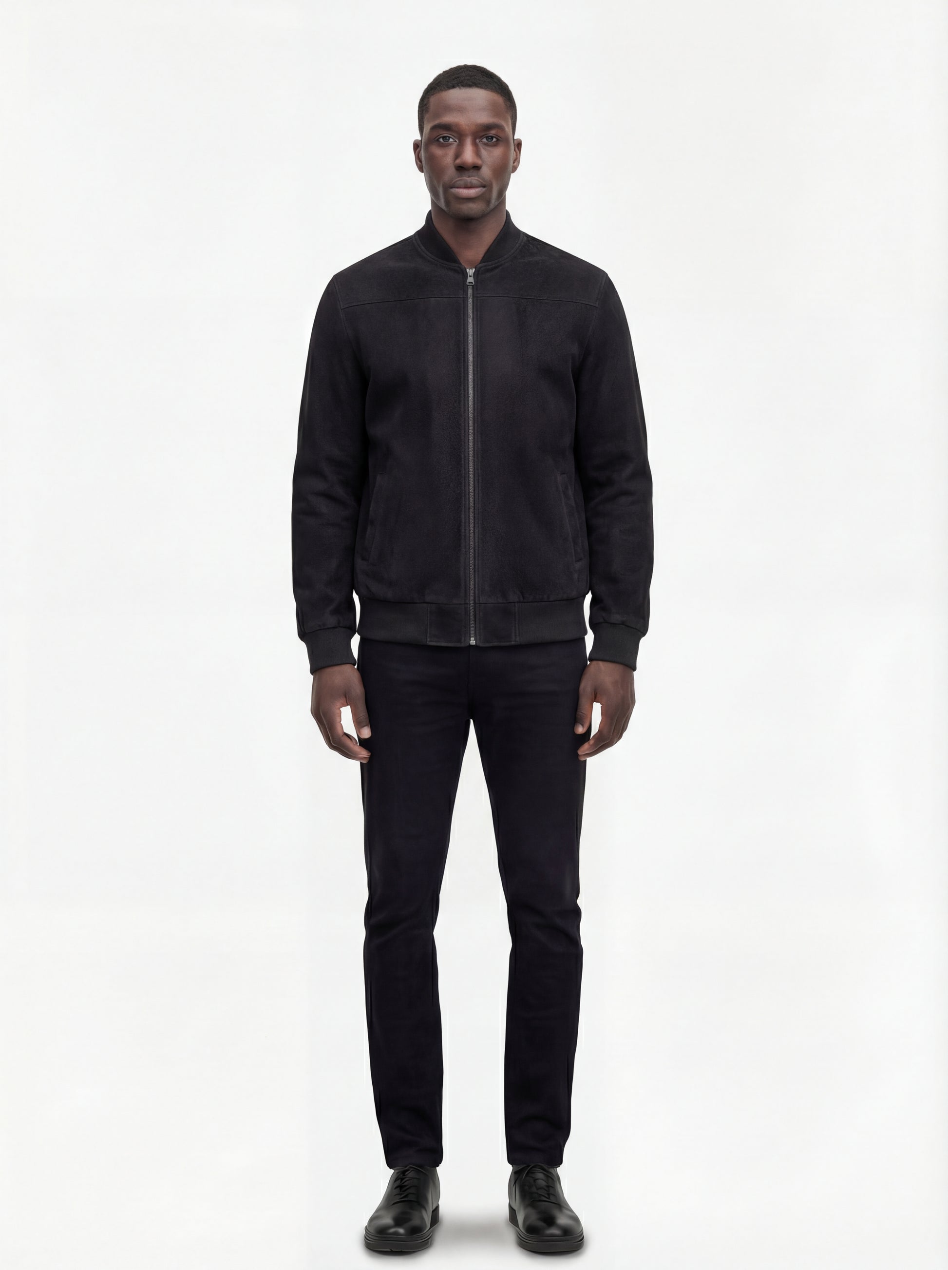 Male model wearing Maverick Felix suede bomber jacket, regular fit, styled with black jeans. Maverick Jacket.