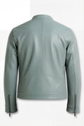Rear view of sage green leather biker jacket showing vertical center seam and structured lower back panel. The Orion by Maverick Jacket.