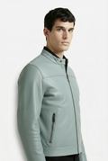 Side profile of Maverick Orion biker jacket showing zippered pocket detail and sleek torso fit. Maverick Jacket.