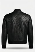 Rear view of black leather bomber jacket showing elaborate diamond quilting and vertical spine paneling. The Vanta by Maverick Jacket.