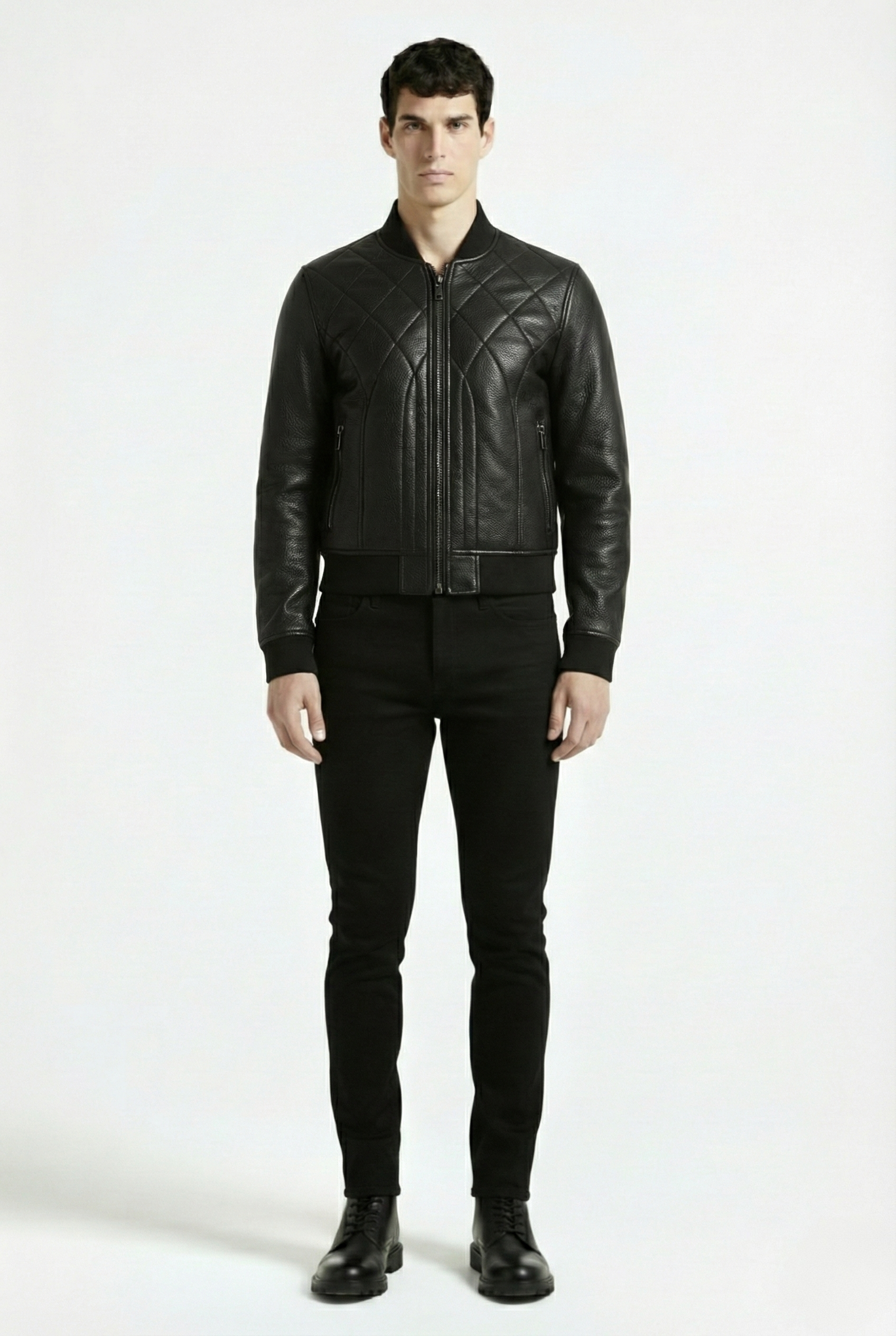 Male model wearing Maverick Vanta bomber jacket, slim fit, styled with black skinny jeans and leather combat boots. Maverick Jacket.