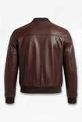 Rear view of dark brown leather bomber jacket showing horizontal shoulder yoke and clean back panel. The Ferran by Maverick Jacket.