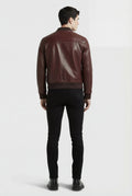 Rear view of male model wearing Maverick Ferran leather bomber jacket showing structured shoulder fit and ribbed hem styling. Maverick Jacket.