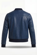 Rear view of navy blue leather bomber jacket showing horizontal shoulder yoke and clean back panel. The Solaro by Maverick Jacket.