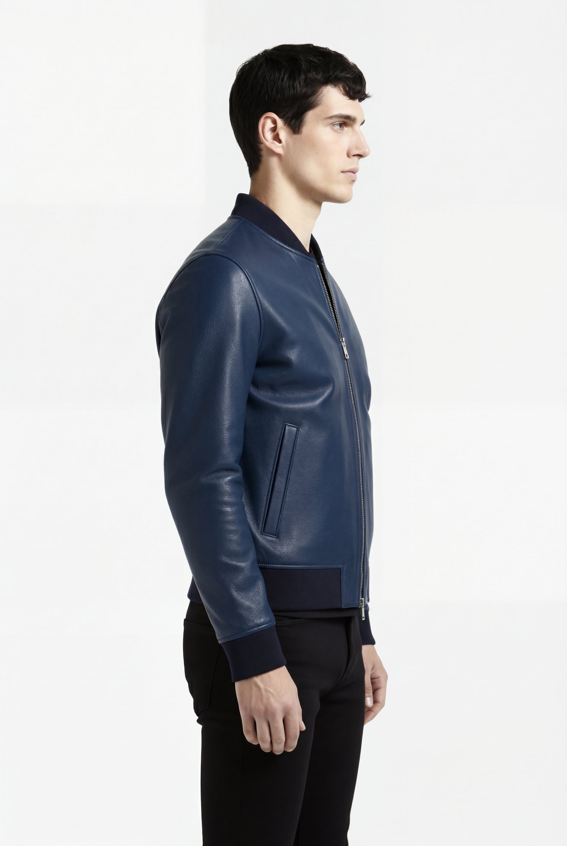 Side profile of Maverick Solaro leather bomber jacket showing ribbed cuff structure and slim tailored silhouette. Maverick Jacket.