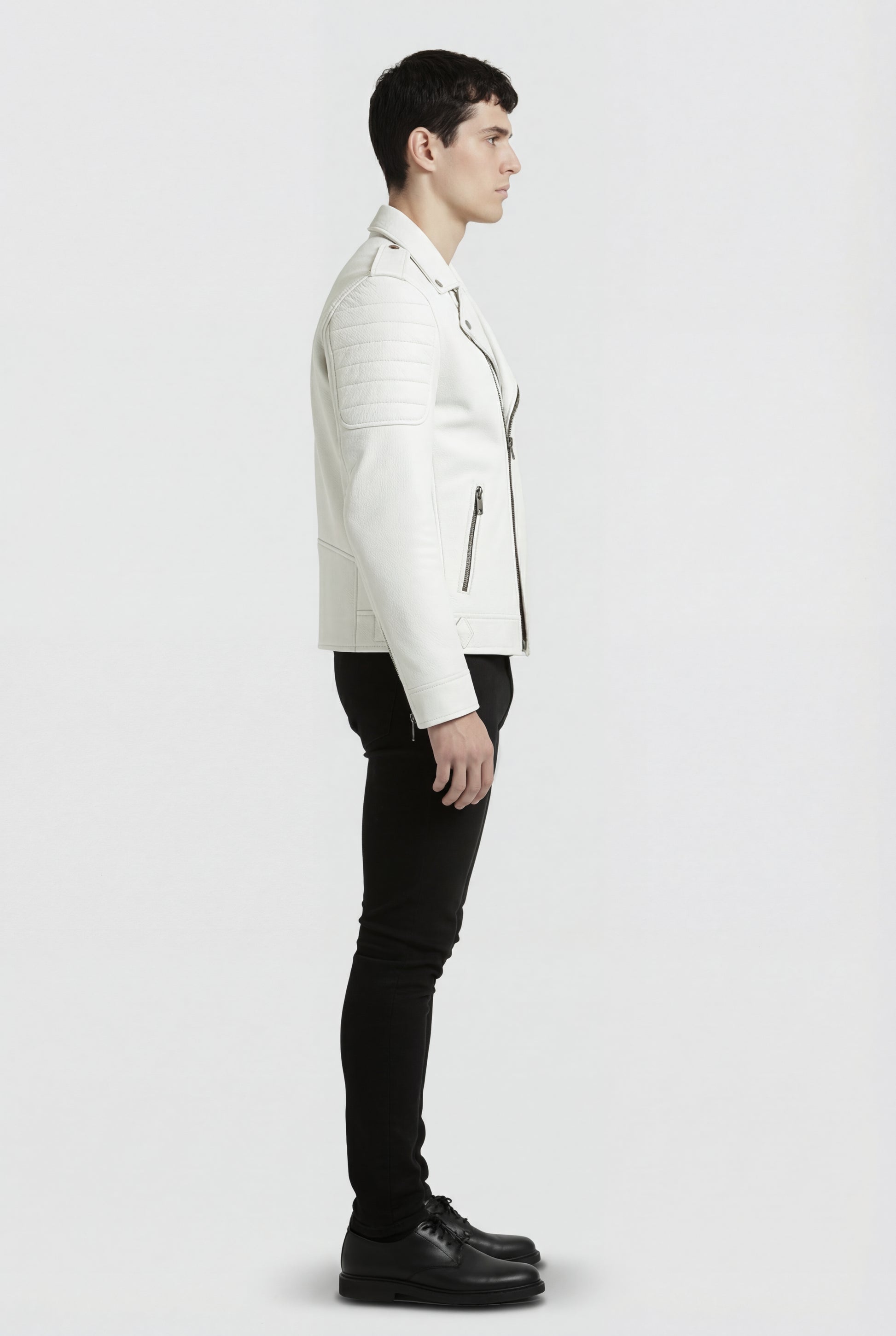 Side profile of Maverick Lucent biker jacket showing ribbed shoulder quilting and slim moto silhouette. Maverick Jacket.