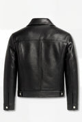 Rear view of black pebbled leather trucker jacket showing vertical center seam and adjustable waist tabs. The Veyron by Maverick Jacket.