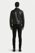 Rear view of male model wearing Maverick Veyron leather trucker jacket showing structured shoulder fit and clean back paneling. Maverick Jacket.