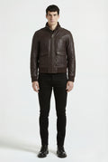 Male model wearing Maverick Alder leather bomber jacket, regular fit, styled with black skinny jeans. Maverick Jacket.