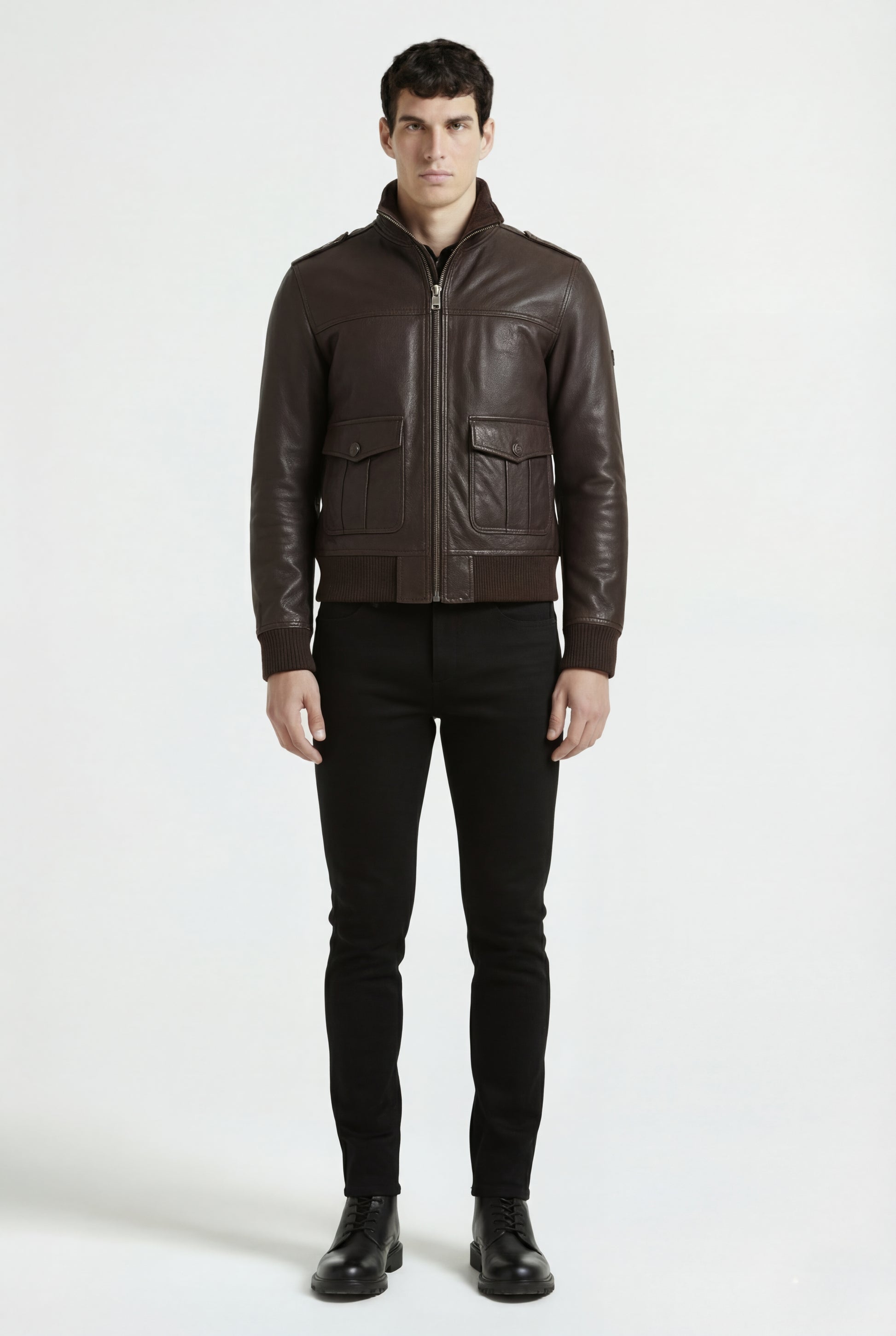 Male model wearing Maverick Alder leather bomber jacket, regular fit, styled with black skinny jeans. Maverick Jacket.