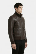 Side profile of Maverick Alder leather bomber jacket showing ribbed cuff structure and classic bomber silhouette. Maverick Jacket.