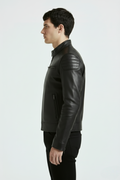 Side profile of Maverick Axton moto jacket showing ribbed shoulder quilting and slim tailored silhouette. Maverick Jacket.