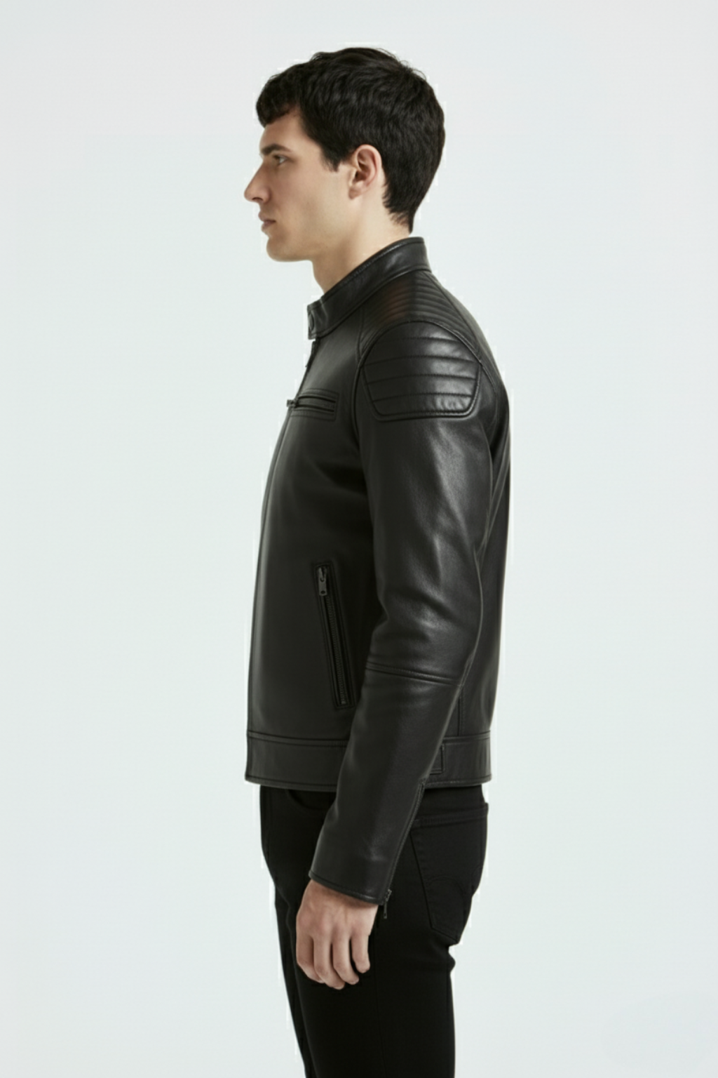 Side profile of Maverick Axton moto jacket showing ribbed shoulder quilting and slim tailored silhouette. Maverick Jacket.