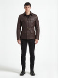 Male model wearing Maverick Huntsman leather field jacket, tailored fit, styled with black crewneck shirt and black slim trousers. Maverick Jacket.