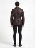 Rear view of male model wearing Maverick Huntsman leather field jacket showing structured shoulder fit and belted waist styling. Maverick Jacket.