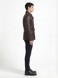 Side profile of Maverick Huntsman field jacket showing sleeve cargo pocket and slim belted silhouette. Maverick Jacket.