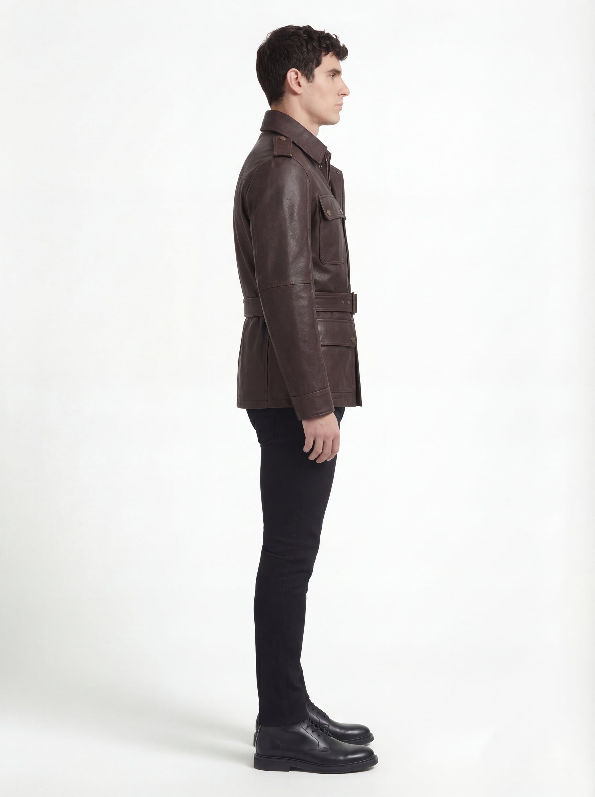Side profile of Maverick Huntsman field jacket showing sleeve cargo pocket and slim belted silhouette. Maverick Jacket.
