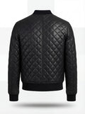 Rear view of black diamond quilted leather bomber jacket showing vertical center seam and ribbed waist hem. The Nero by Maverick Jacket.