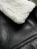 Macro shot of pebbled black leather texture and white shearling collar fleece on jacket. The Corbin by Maverick Jacket.