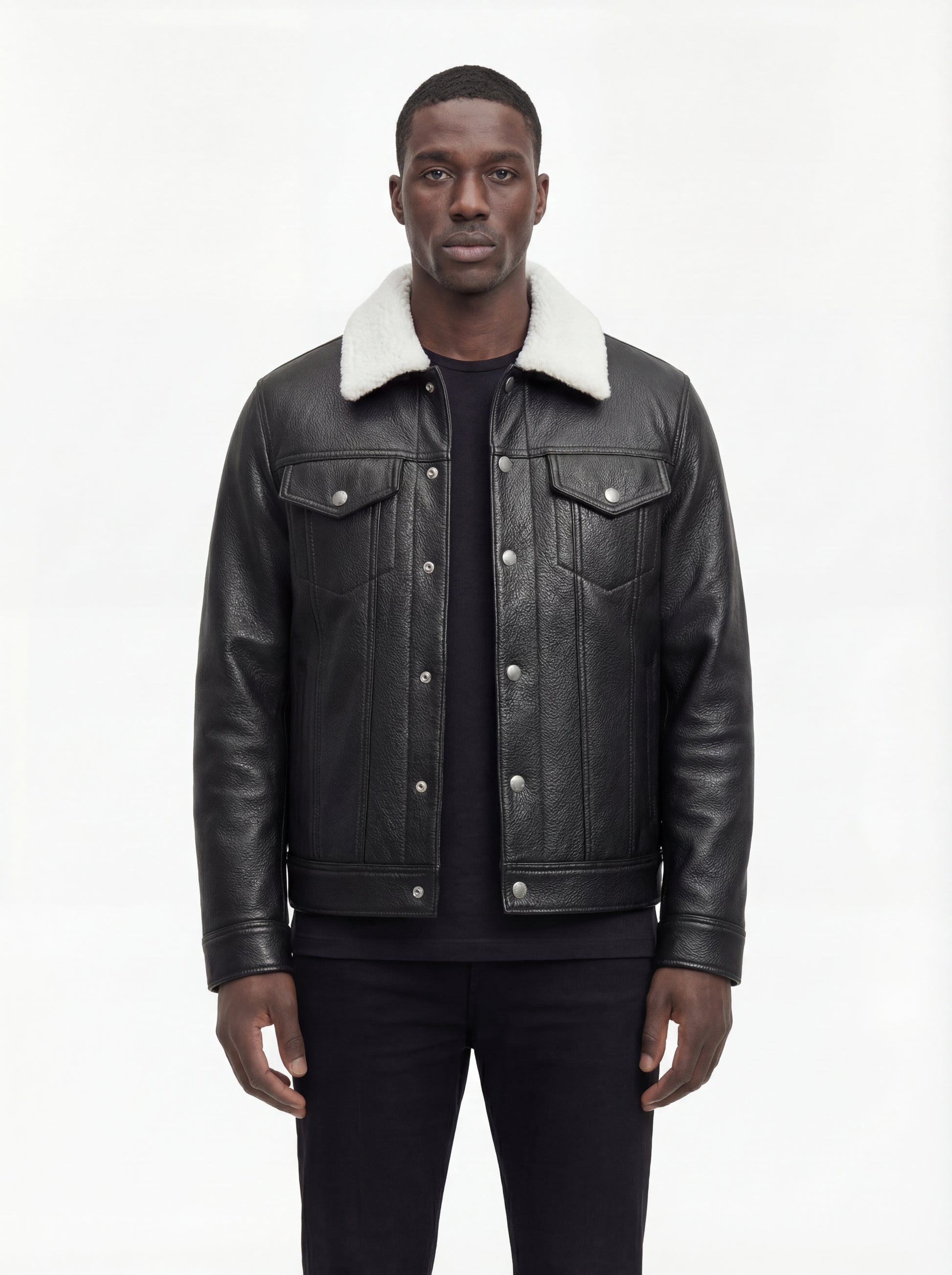 Male model wearing Maverick Corbin leather jacket, regular fit, styled with black crewneck t-shirt and black slim-fit trousers. Maverick Jacket.