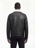 Rear view of male model wearing Maverick Corbin leather jacket showing structured shoulder fit and clean back paneling. Maverick Jacket.