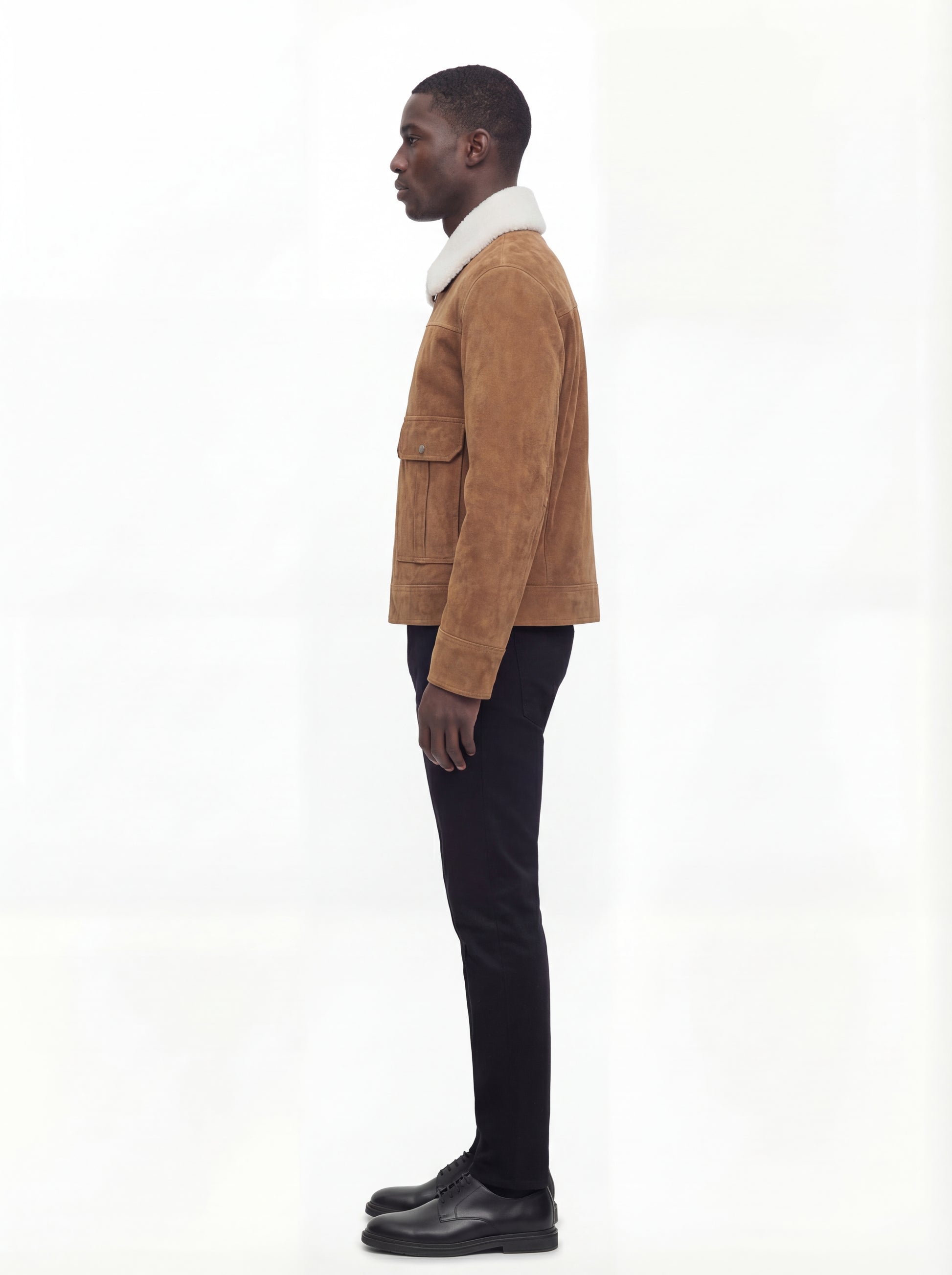 Side profile of Maverick Caden suede shearling jacket showing straight sleeve structure and regular silhouette. Maverick Jacket.