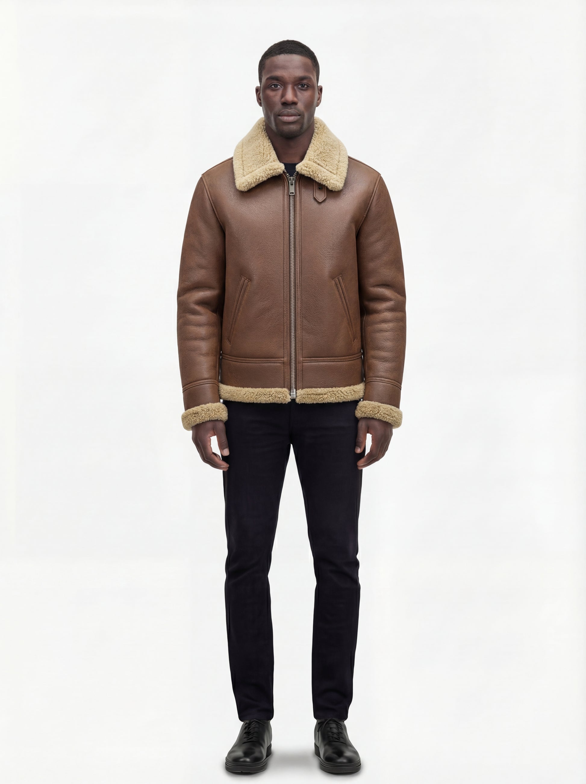 Male model wearing Maverick Sterling shearling aviator jacket, regular fit, styled with black crewneck t-shirt and black slim-fit jeans. Maverick Jacket.