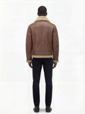 Rear view of male model wearing Maverick Sterling shearling aviator jacket showing structured shoulder fit and shearling-trimmed hem. Maverick Jacket.