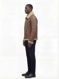 Side profile of Maverick Sterling shearling aviator jacket showing slanted zipper pocket and straight silhouette. Maverick Jacket.