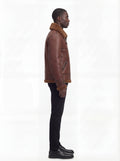 Side profile of Maverick Sol  B3 shearling bomber jacket showing adjustable cuff strap and straight silhouette. Maverick Jacket.