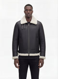 Male model wearing Maverick Ronan shearling B3 bomber jacket, regular fit, styled with black slim-fit trousers. Maverick Jacket.
