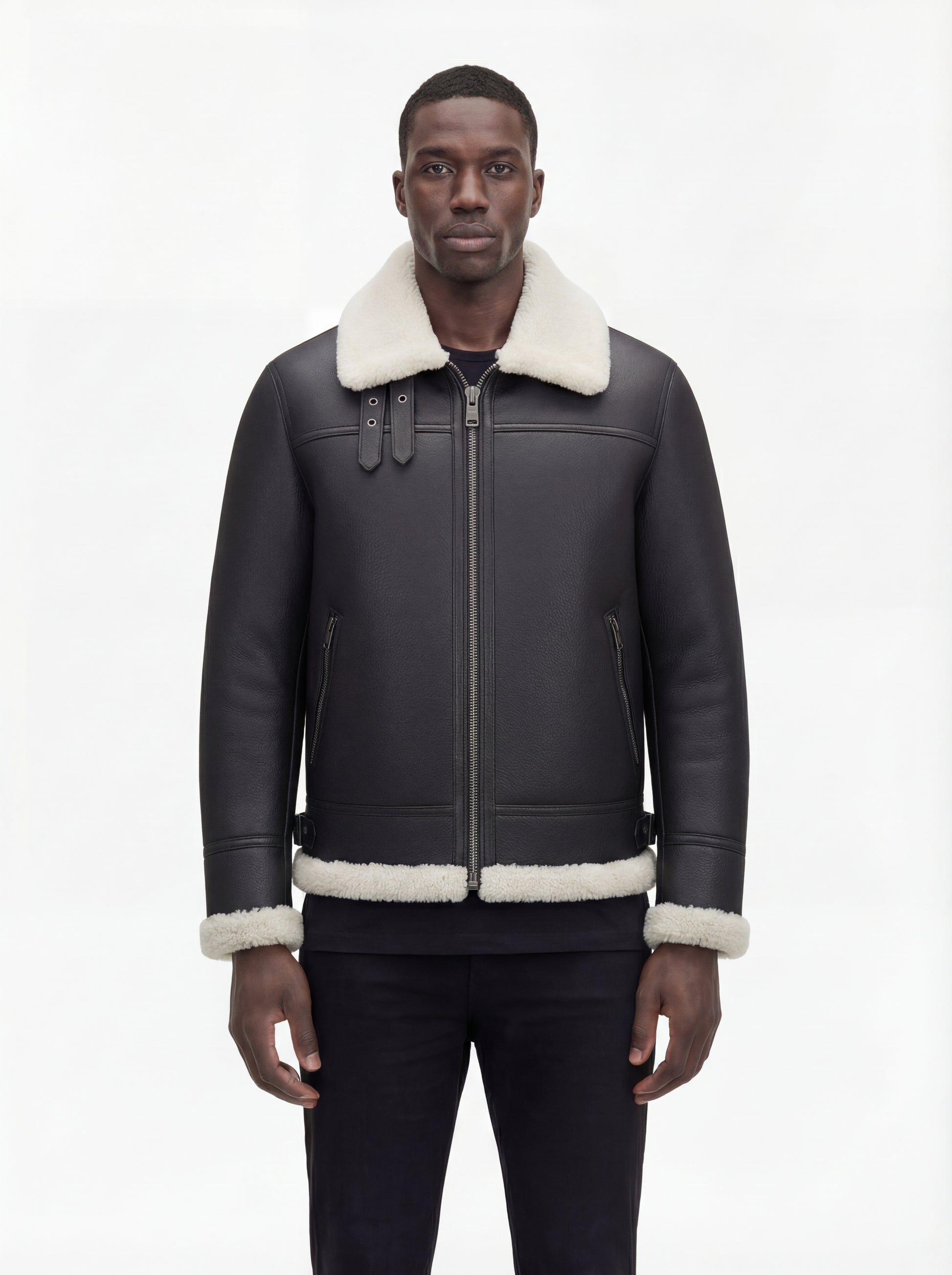 Male model wearing Maverick Ronan shearling B3 bomber jacket, regular fit, styled with black slim-fit trousers. Maverick Jacket.