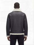 Rear view of male model wearing Maverick Ronan shearling B3 bomber jacket showing broad shoulder fit and shearling-trimmed hem. Maverick Jacket.