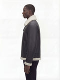 Side profile of Maverick Ronan shearling B3 bomber jacket showing zippered side pocket and straight silhouette. Maverick Jacket.