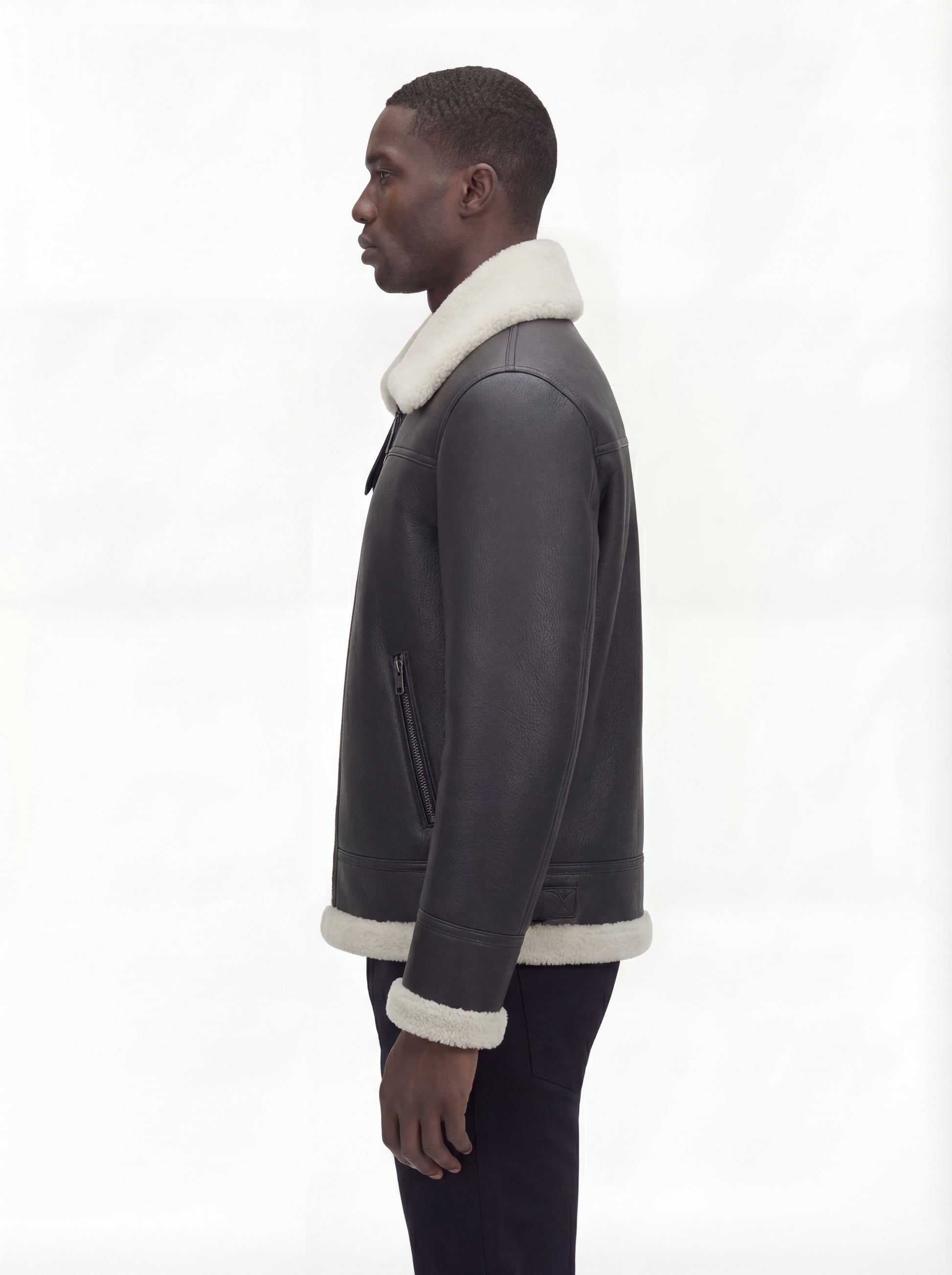 Side profile of Maverick Ronan shearling B3 bomber jacket showing zippered side pocket and straight silhouette. Maverick Jacket.