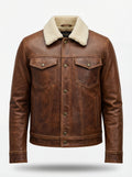Men's Distressed Brown Leather Trucker Jacket with cream shearling collar and button-flap chest pockets, Front View. The Wyatt by Maverick Jacket.