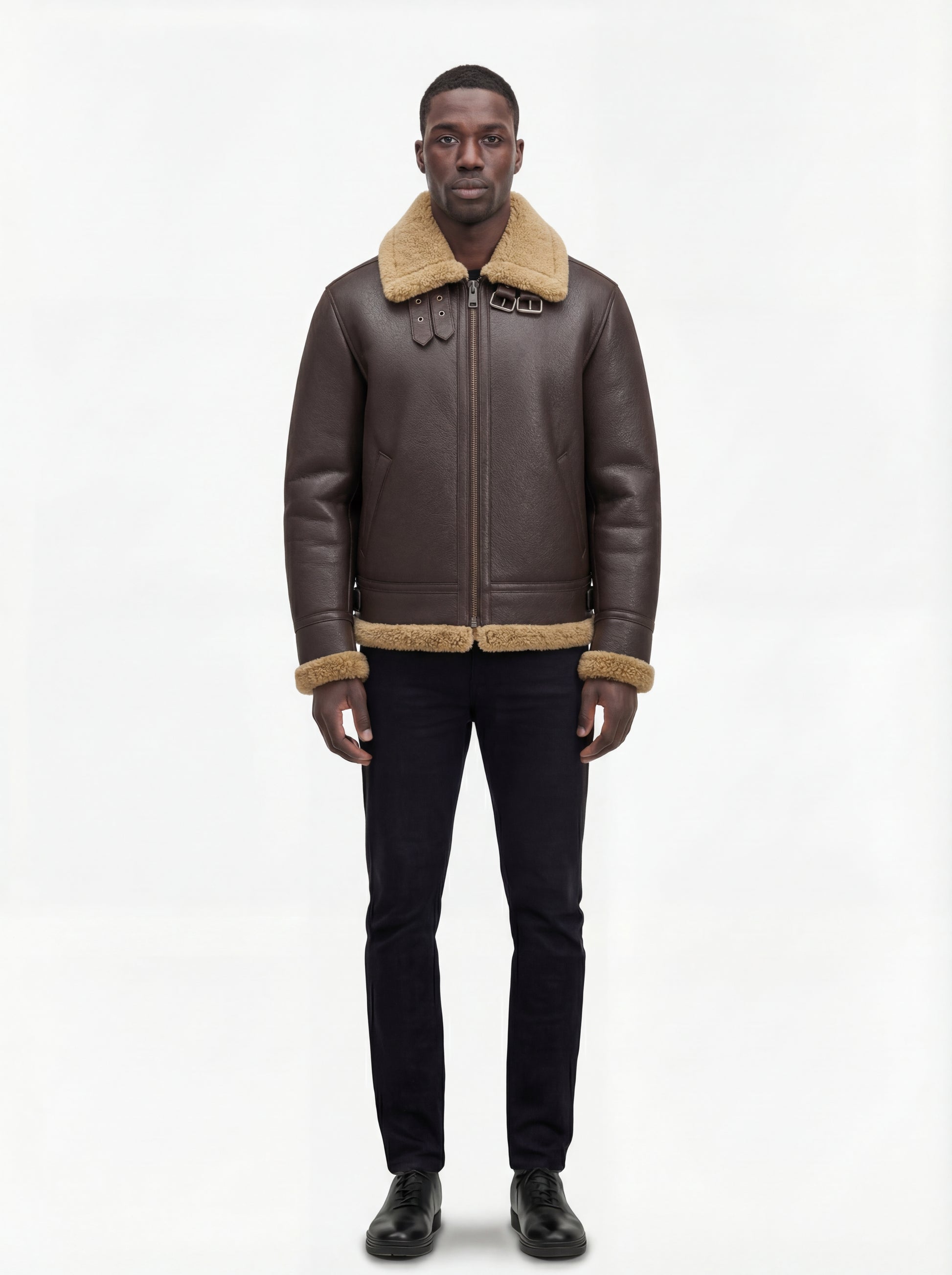 Male model wearing Maverick Beckett shearling aviator jacket, regular fit, styled with black slim-fit jeans and black leather shoes. Maverick Jacket.