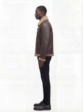 Side profile of Maverick Beckett shearling aviator jacket showing shearling cuff detail and straight silhouette. Maverick Jacket.