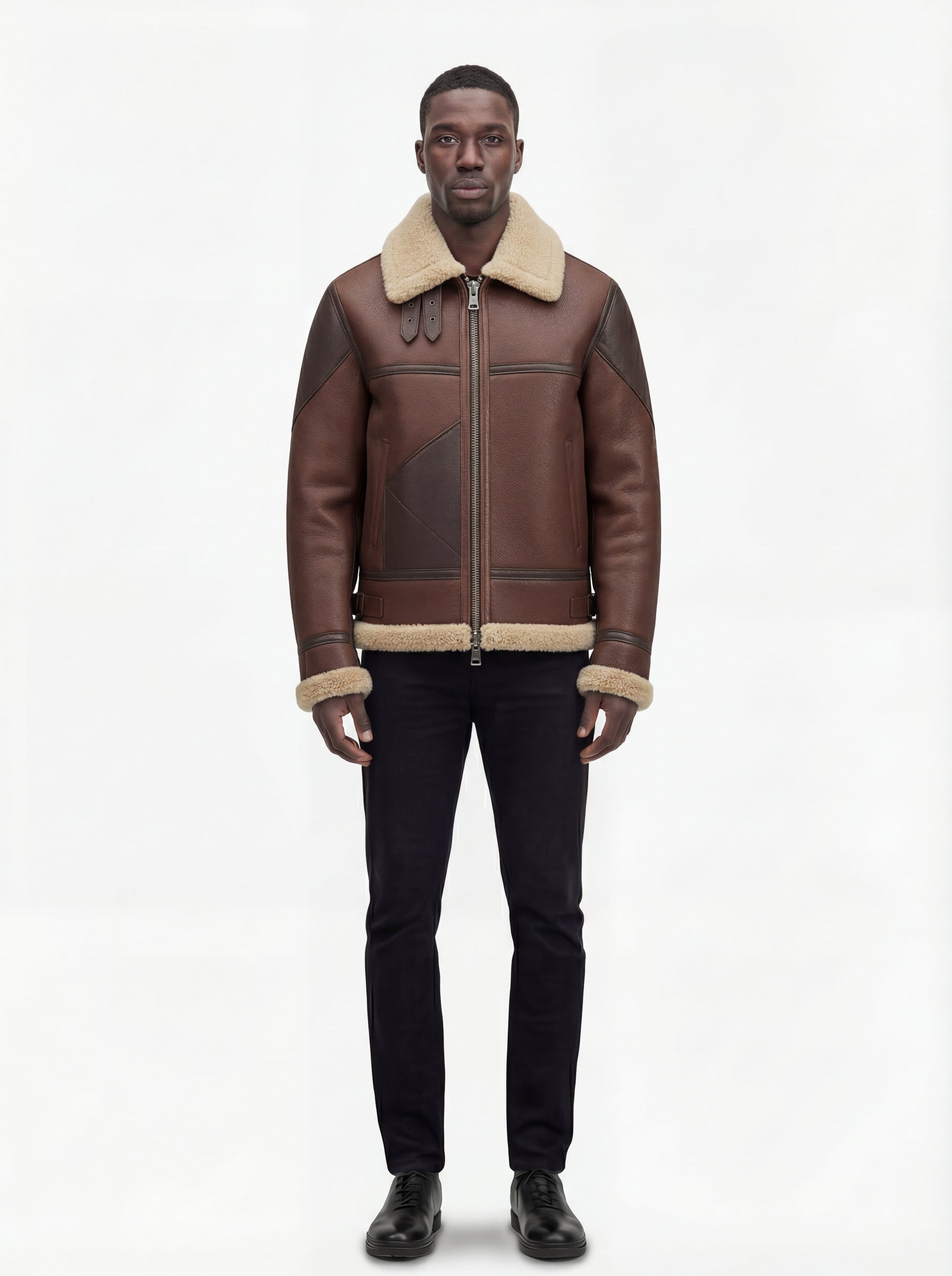 Male model wearing Maverick Hayes shearling aviator jacket, regular fit, styled with black slim-fit jeans and black leather shoes. Maverick Jacket.