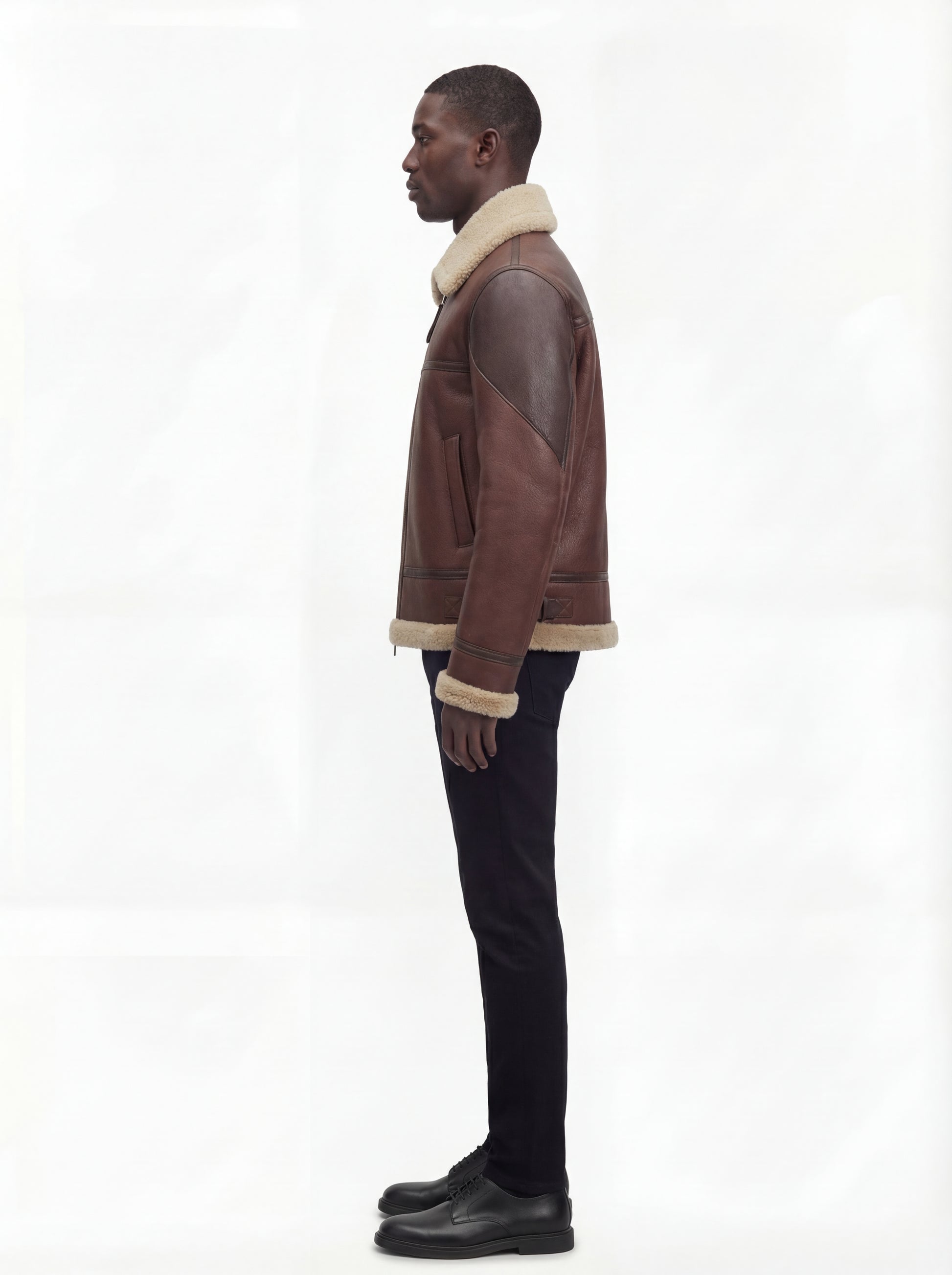 Side profile of Maverick Hayes shearling aviator jacket showing contrasting arm panel and regular fit silhouette. Maverick Jacket.