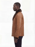 Side profile of Maverick Alistair showing shearling cuff detail and straight mid-length silhouette. Maverick Jacket.