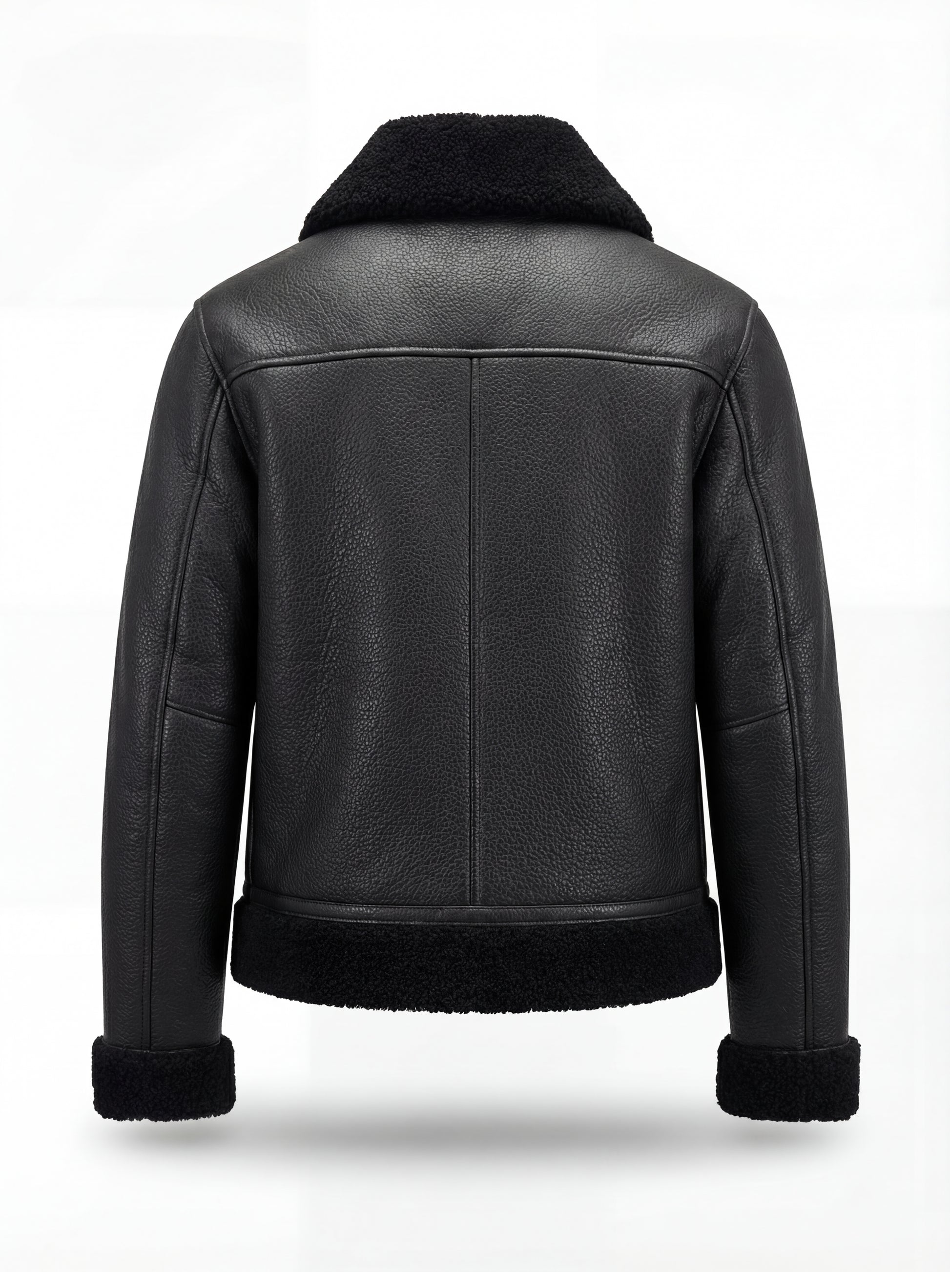 Rear view of Black Leather Shearling Jacket showing vertical center seam and shearling hem trim. The Zane by Maverick Jacket.