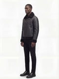 Side profile of Maverick Zane shearling jacket showing shearling cuff detail and straight silhouette. Maverick Jacket.
