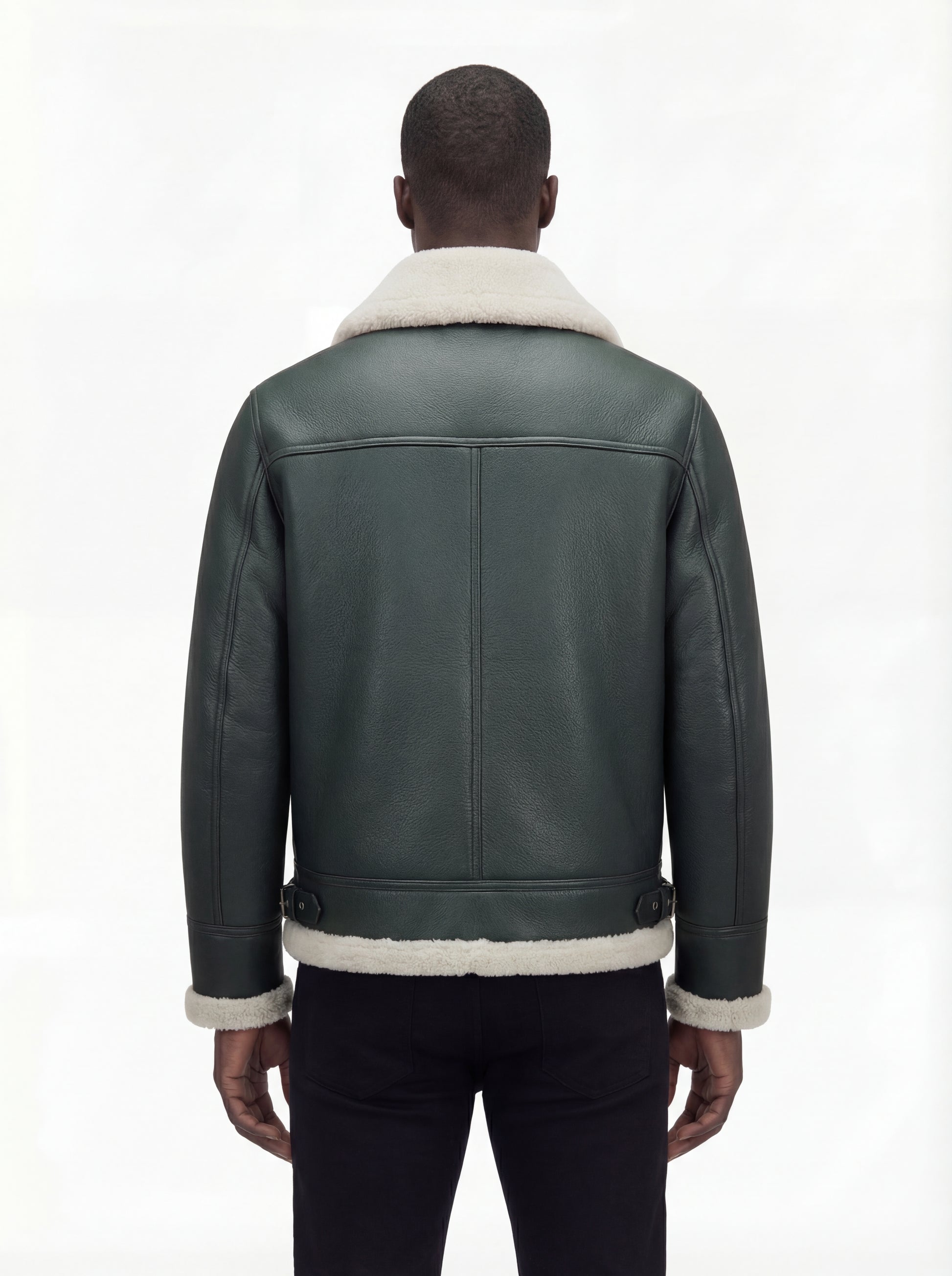 Rear view of male model wearing Maverick Lorcan shearling aviator jacket showing structured shoulder fit and shearling-trimmed hem. Maverick Jacket.