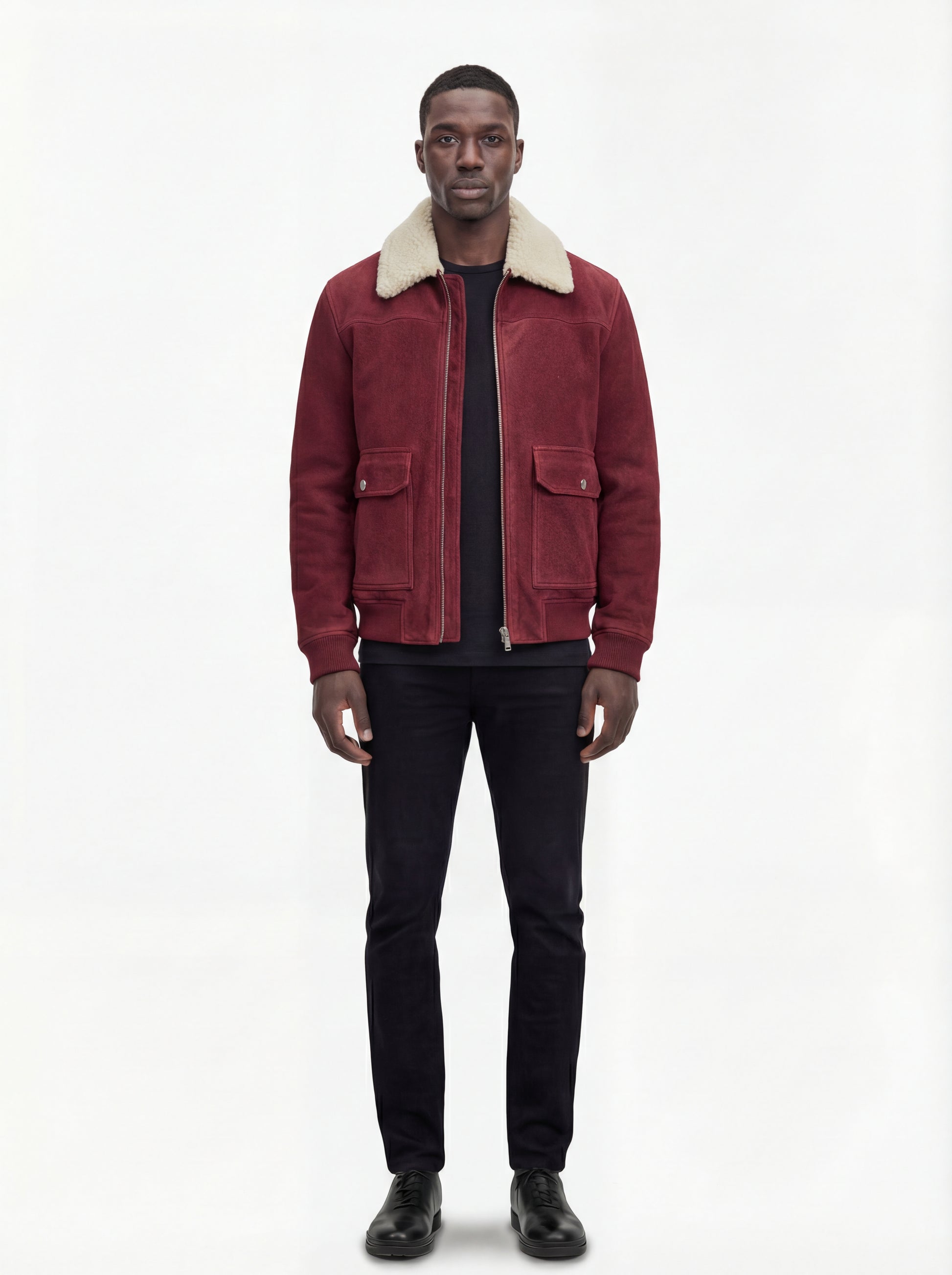Male model wearing Maverick Rory suede bomber jacket, regular fit, styled with black crewneck t-shirt and black slim-fit jeans. Maverick Jacket.