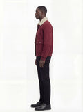 Side profile of Maverick Rory suede bomber jacket showing ribbed cuff detail and relaxed silhouette. Maverick Jacket.
